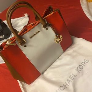 A Orange white and brown bag.